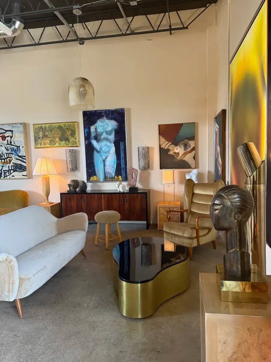 A Miami rental showroom with modern and vintage furniture, lighting, and artwork.